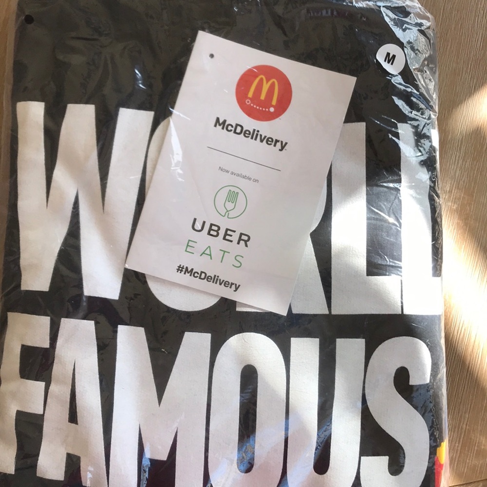 Black Cotton Hoodie inscribed with “World Famous.”